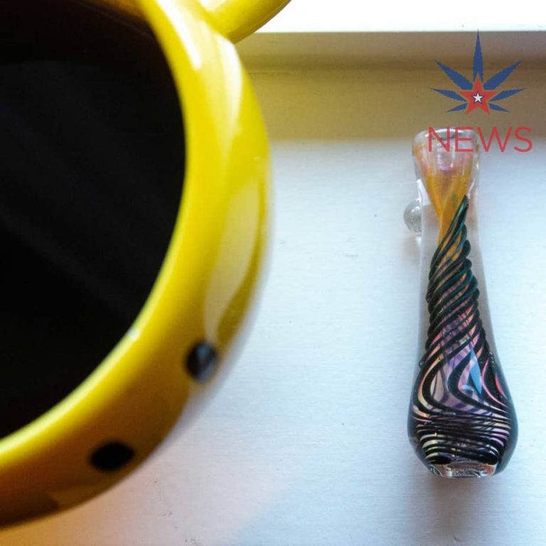One hitter next to a large smiley face coffee cup.